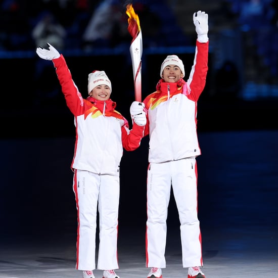 Uyghur Athlete Lights Olympic Flame in Opening Ceremony