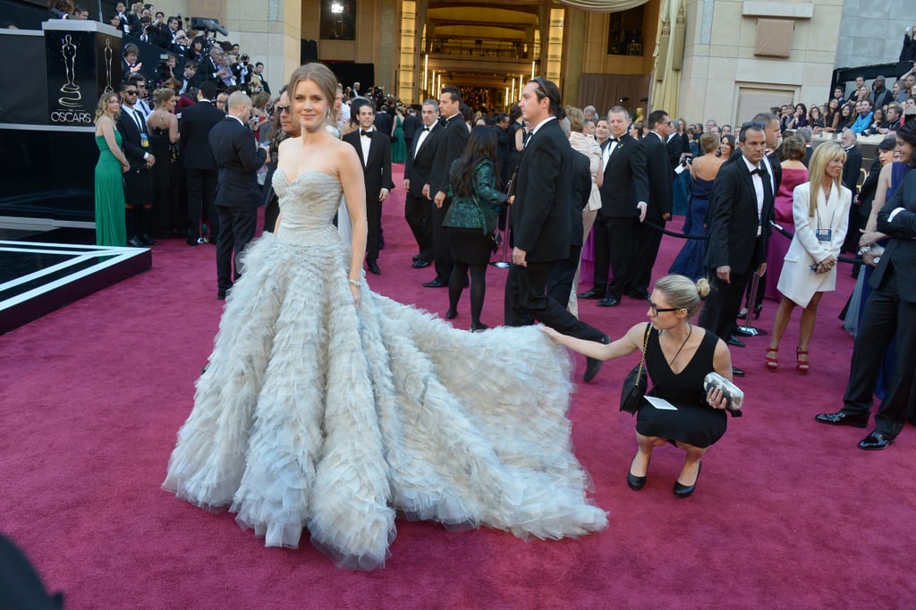 Amy Adams had help adjusting her train.
Amy Adams had help adjusting her train.