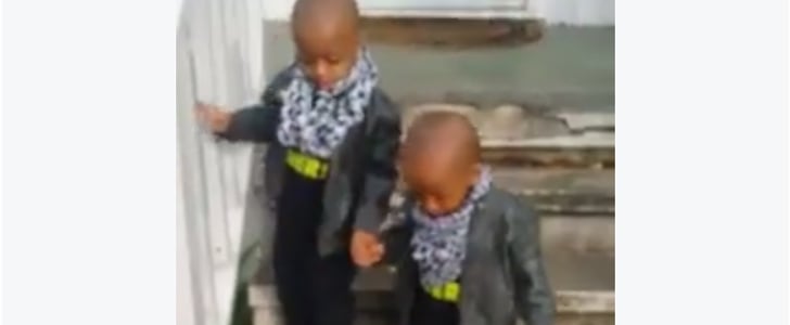 Twin Brothers Help Each Other Walk Down Stairs