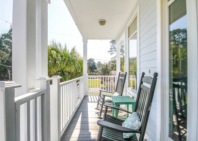 Enjoy your morning cup of Captain Michael's coffee on the front balcony porch.