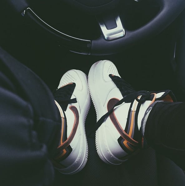 Kylie shared a snap of herself behind the wheel, rocking her multicolor Nike high-tops.