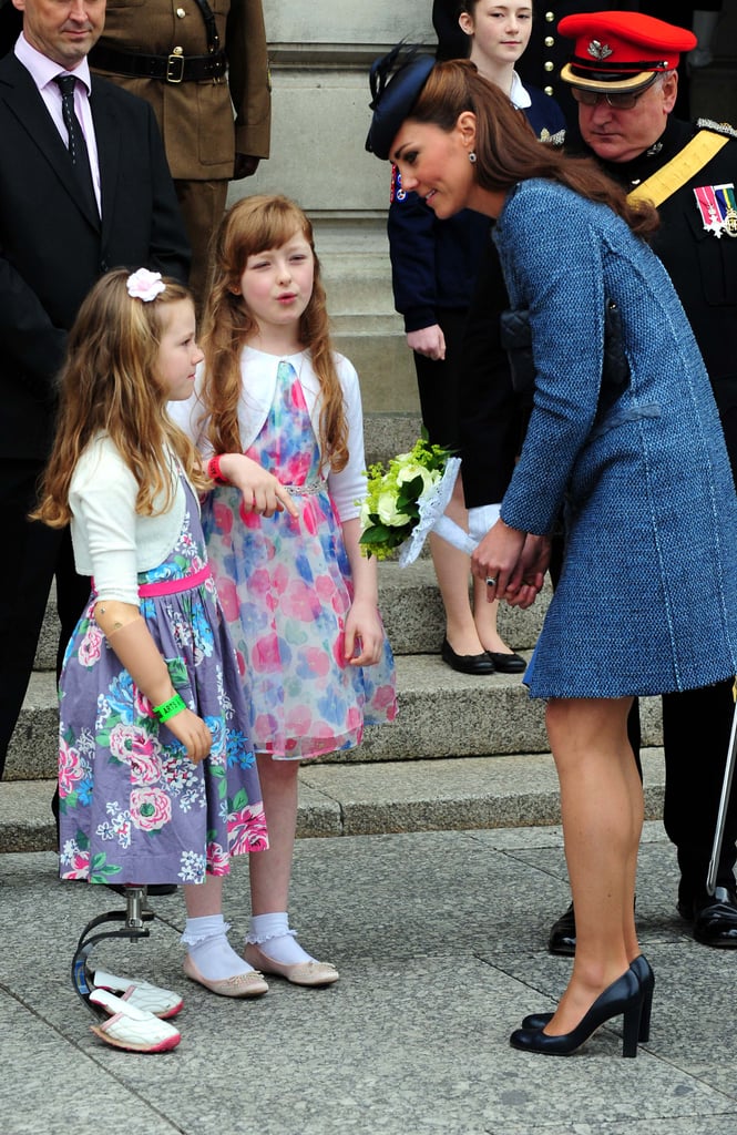 Kate Middleton talked to local children during a visit to Council House in Nottingham, England, in June 2012. She accepted a bouquet of flowers from one little girl who had prosthetic metal legs.