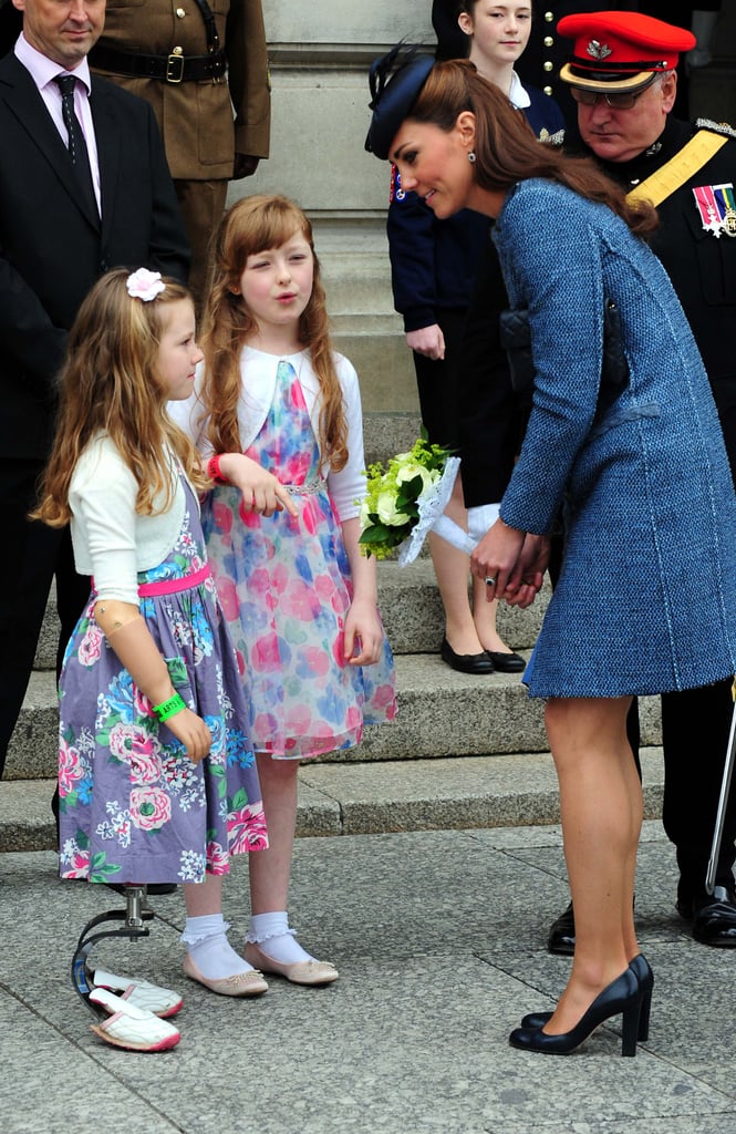 Kate talked to local children during a visit to Council House in Nottingham, England, in June 2012. She accepted a bouquet of flowers from one little girl who had prosthetic metal legs.