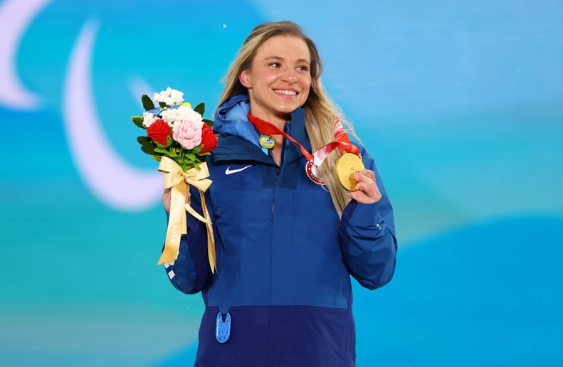 Gold medalist Oksana Masters of Team United States poses during the Para Biathlon Women's Sprint Sitting medal ceremony on day two of the Beijing 2022 Winter Paralympics.