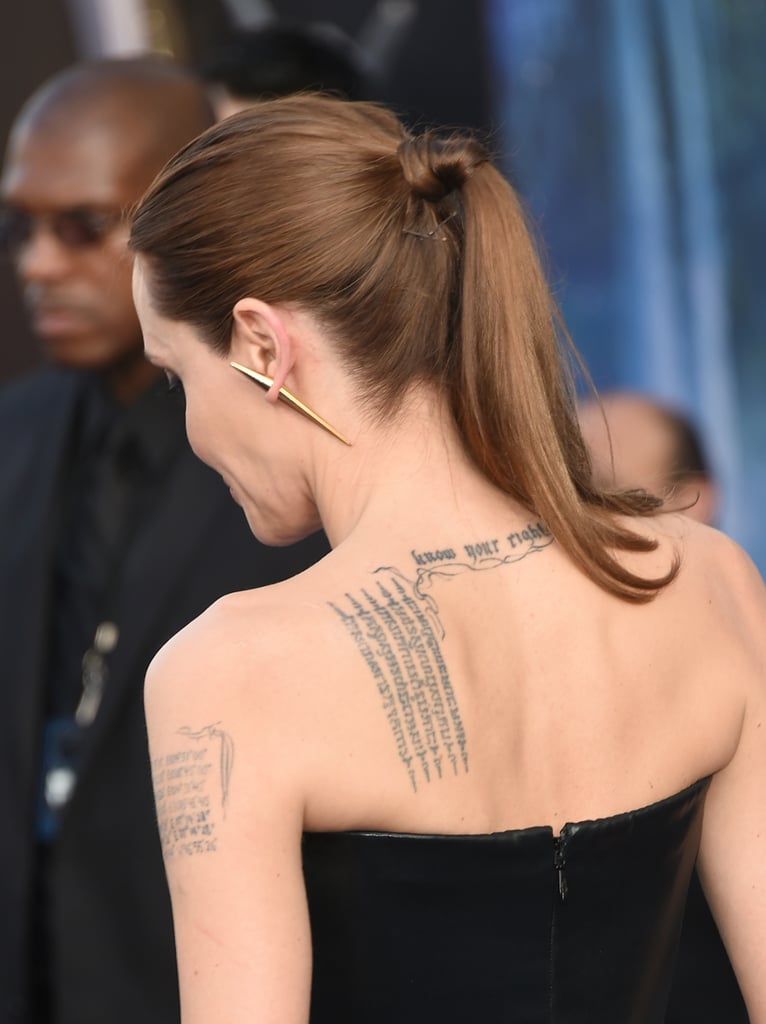 Image result for Ear piercing Angelina Jolie
