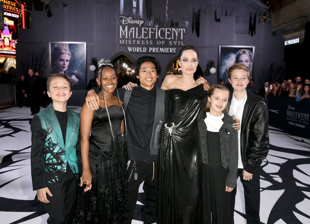 Angelina Jolie had the full support of her family at the Maleficent: Mistress of Evil premiere on Monday night. The 44-year-old actress brought her kids to the El Capitan theater in Los Angeles, with the exception of 18-year-old Maddox, who is away at college in Singapore. 
The mom of six celebrated her big night in a rare public outing with Pax, 15, Zahara, 14, Shiloh, 13, and twins Vivienne and Knox, 11. Her crew looked smiley and happy together as they posed on the red carpet for photos. It's crazy how grown-up they all are! 
Earlier this month, Angelina told Hello! magazine that she's "rediscovering" herself as a mother of teenagers. "As they grow up, I find my children are strong individuals but still open-minded," Angelina said. "I try to lead by example and be kind and gracious, as my mother was — and loving and tolerant." Such valuable advice for any parent. 
Catch Maleficent: Mistress of Evil in theaters starting Oct. 18.