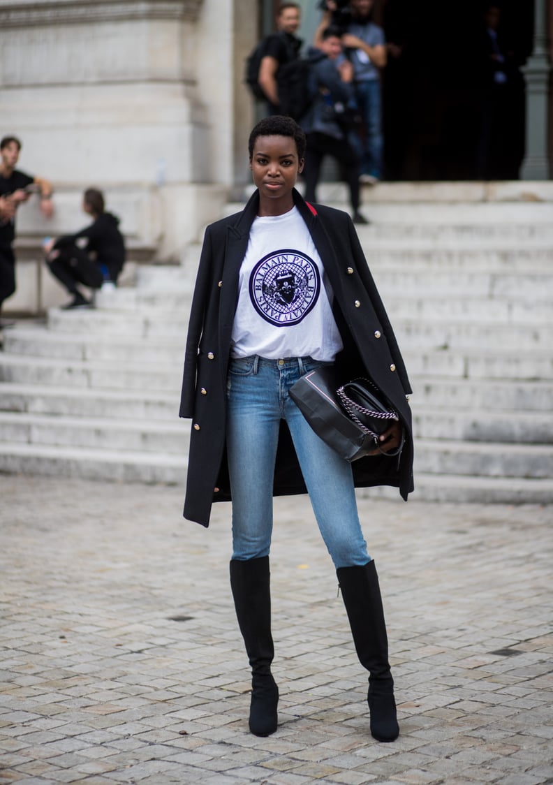 With a Logo Tee, a Military-Inspired Coat, Heeled Boots, and a Tote Bag