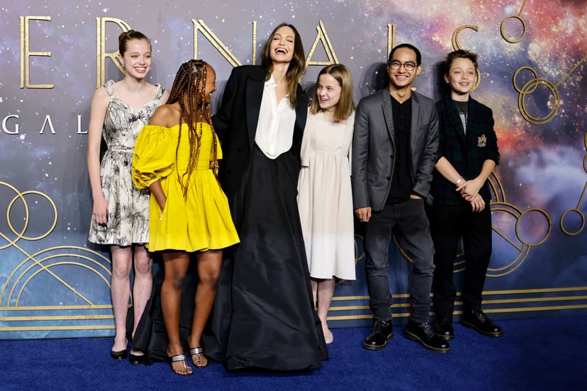 TOPSHOT - US actor Angelina Jolie (3rd L) poses with her children, (L-R) Shiloh Jolie-Pitt, Zahara Jolie-Pitt, Vivienne Jolie-Pitt, Maddox Jolie-Pitt and Knox Jolie-Pitton on the blue carpet on arrival to attend the UK Gala Screening of the film 'Eternals