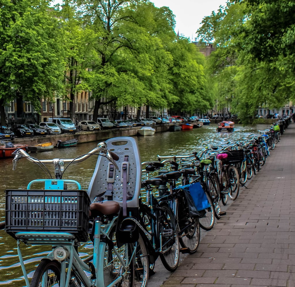 Of course, when you're visiting the bike capital of the world, there's a good chance you will want to take part in this quintessential Amsterdam experience, right? With pancake-flat roads and a bike-friendly community, renting bikes is quite easy and relatively inexpensive. 
Check out Mike's Bike Rentals if you're interested in exploring the city this way. The staff is friendly. The prices are affordable. And the best part? This company rents out undercover rental bikes, so you can ride around incognito and not advertise yourself as a tourist!