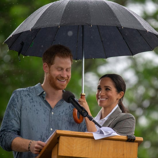 Meghan Markle Holding Prince Harry's Umbrella October 2018