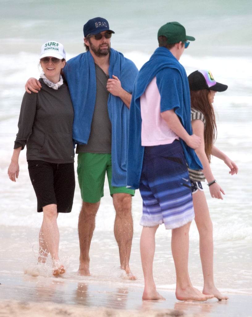 Julianne walked with her family on the beach.