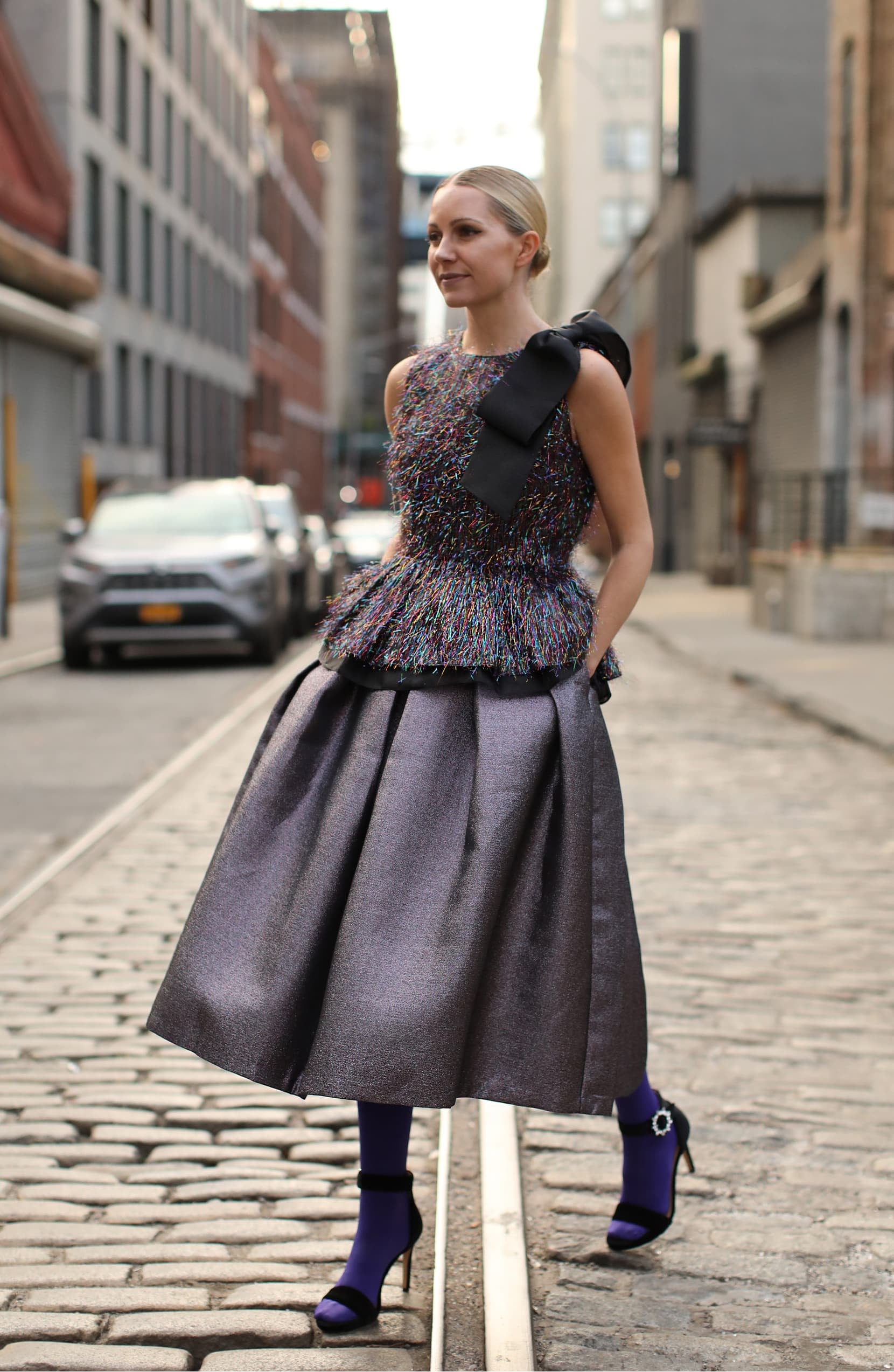 Blair Eadie wears a red lace dress and matching red Valentino