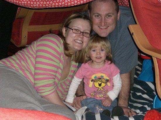 In a fort with her Mama and Daddy. In a fort with her Mama and Daddy.
