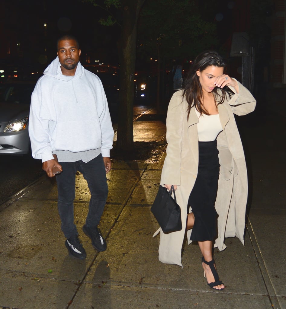 Kim wore a polished black and beige look, and Kanye kept up the neutral theme with a cozy white pullover.