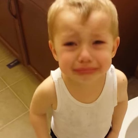 Little Boy Flushing Goldfish in Toilet