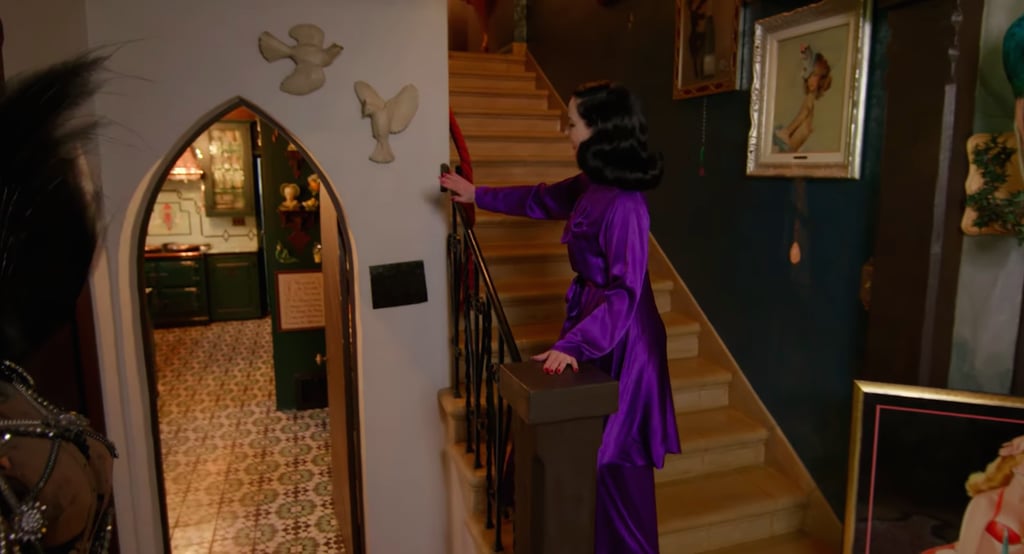 "I really loathe white walls," said Dita, before gesturing to one of the few remaining ones in her home. She added, "There are a few white walls left like this one here, because I'm going to cover this in feathers."