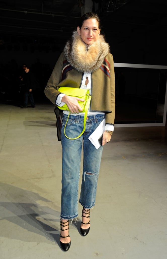 Fancy accessories dress up her trusty oversized jeans. Fancy accessories dress up her trusty oversized jeans.