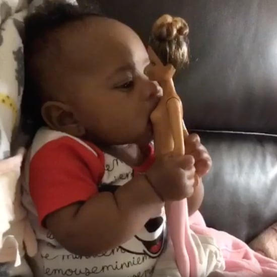 Baby Trying to Breastfeed Off a Naked Barbie Doll