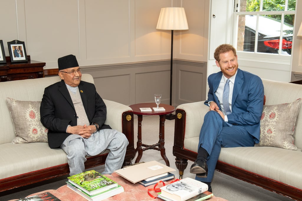 During Prince Harry's visit with the Prime Minister of Nepal, eagled-eyed fans spotted a rare photo of him with Meghan Markle. Even though the Duchess of Sussex is still on maternity leave, the royal found a way to keep his wife close by as he met with Sharma Oli his wife Radhika Shakya at Kensington Palace on Tuesday. In the background of one of the photos, you can just make out a picture of Harry and Meghan in the background. 
While the photo hasn't been released to the public, it isn't the first time we've caught a glimpse of the cute moment between the royal couple. In May 2018, Queen Elizabeth II had the same photo at Buckingham Palace, albeit with a different frame. While Meghan is still on maternity leave following the birth of her first son, she did make a unexpected appearance at Trooping the Colour on Saturday. Hopefully she'll step out for more surprise outings in the future! 

    Related:

            
            
                                    
                            

            31 Times Harry and Meghan Made Their Love For Each Other Loud and Clear