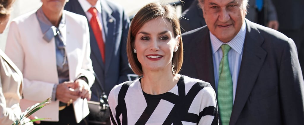 Queen Letizia Holds a Baby in Madrid Pictures