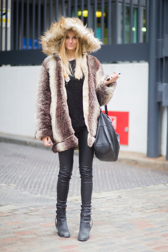 Bridget's style is equally bold on the street as it is on the red carpet. Here, she posed during London Fashion Week in a furry hooded coat, leather skinnies, and functional black booties.