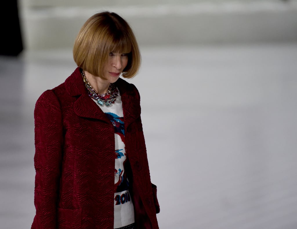 Anna Wintour covered her Hillary shirt in a crisp red coat.