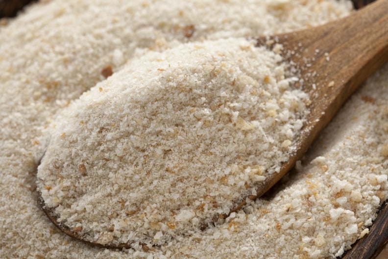 Bread crumbs in wooden spoon