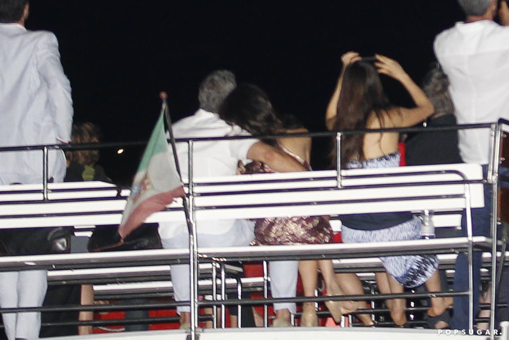 So sweet! George and Amal cuddled up and watched fireworks on Lake Como for the Fourth of July.