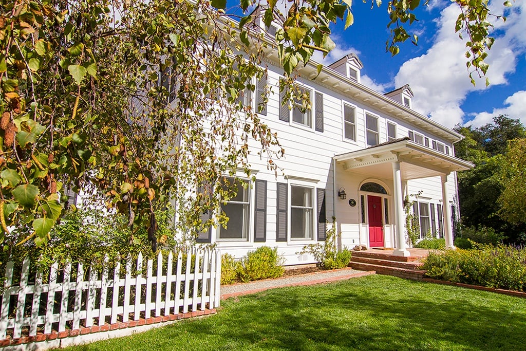 The stunning Colonial is full of luxurious features, such as top-of-the-line appliances, high ceilings, hardwood floors, and four fireplaces.