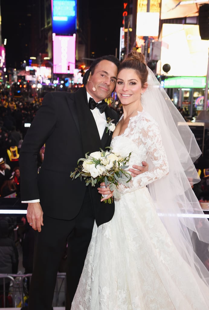 After almost 20 years of dating, Maria Menounos and Keven Undergaro are officially husband and wife. The longtime couple managed to pull off a surprise wedding during Fox's New Year's Eve broadcast, which Maria was cohosting with Steve Harvey. Not only did Steve help with the nuptials by officiating the wedding, but Maria's parents, Constantine and Litsa Menounos, were present as well. "Finally some good news for mom!" the television host captioned a video of her breaking the news to her parents on Instagram. "We are getting married tonight in Times Square! I will be the coldest bride ever but the happiest! Seeing my parents happy means everything!" 
The exciting celebration comes after a particularly trying year for Maria. In July, she revealed that she underwent a seven-hour surgery to remove a brain tumor the size of a golf ball. While the tumor was successfully removed, she also revealed that she was taking a leave of absence from E! News to be with her mother, who is currently fighting stage 4 brain cancer. She even shared a heartwarming snap of her kissing her mom's shaved head on Instagram. We're glad her family could be there for such a special moment.