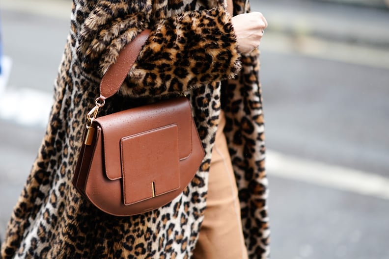 Style Your Leopard-Print Coat With: A Sleek Brown Bag and Tan Pants