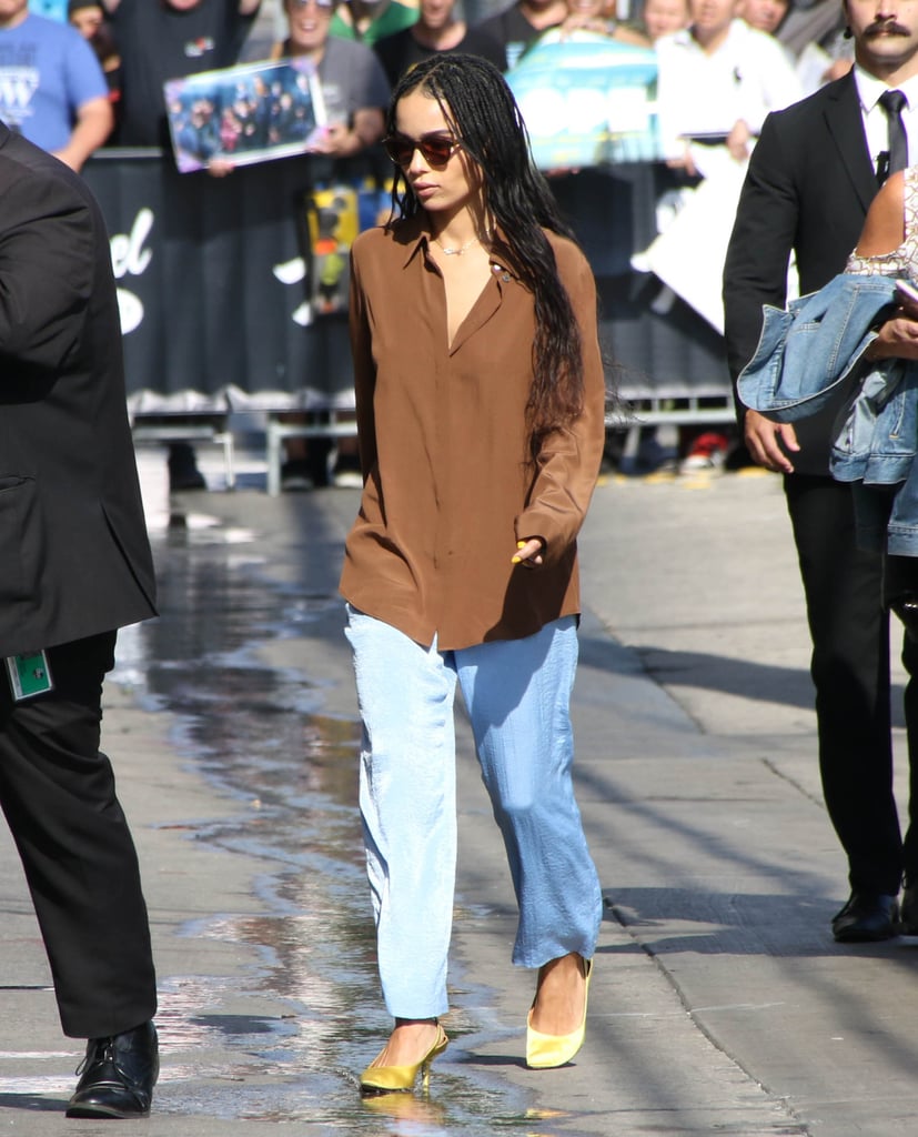 While in L.A., Zoë made a baggy button-down shirt look more feminine with yellow kitten heels.