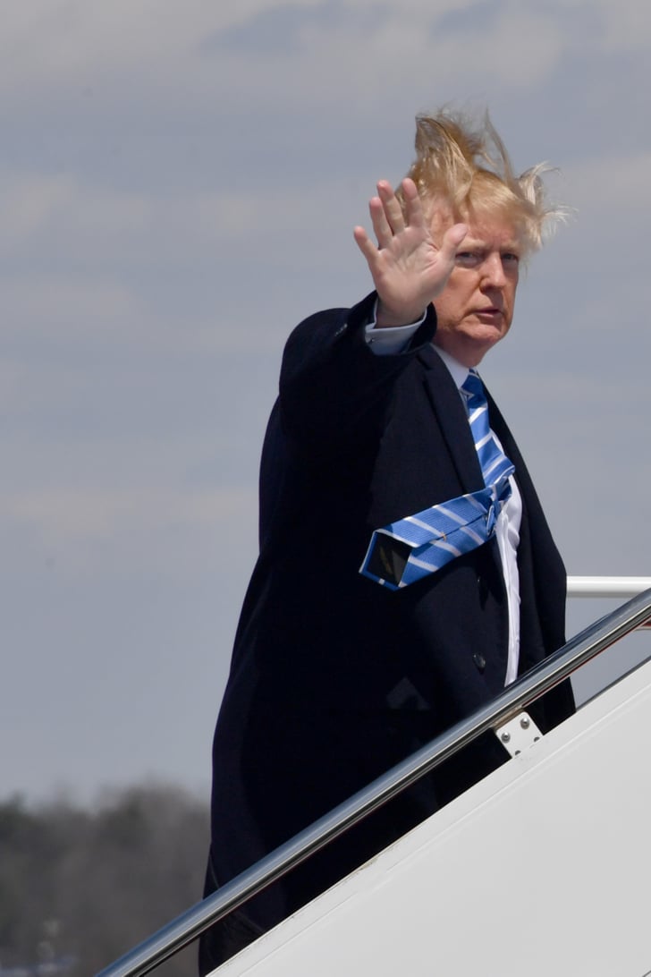 His tie almost flew away, too.  Trump's Hair Blowing 