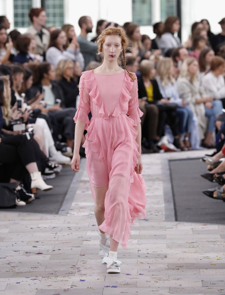 We can picture her staying on the same side of the rainbow, choosing a powder pink dress with ruffles. She'd play it up with drop earrings and a box clutch.
Preen Spring 2017.