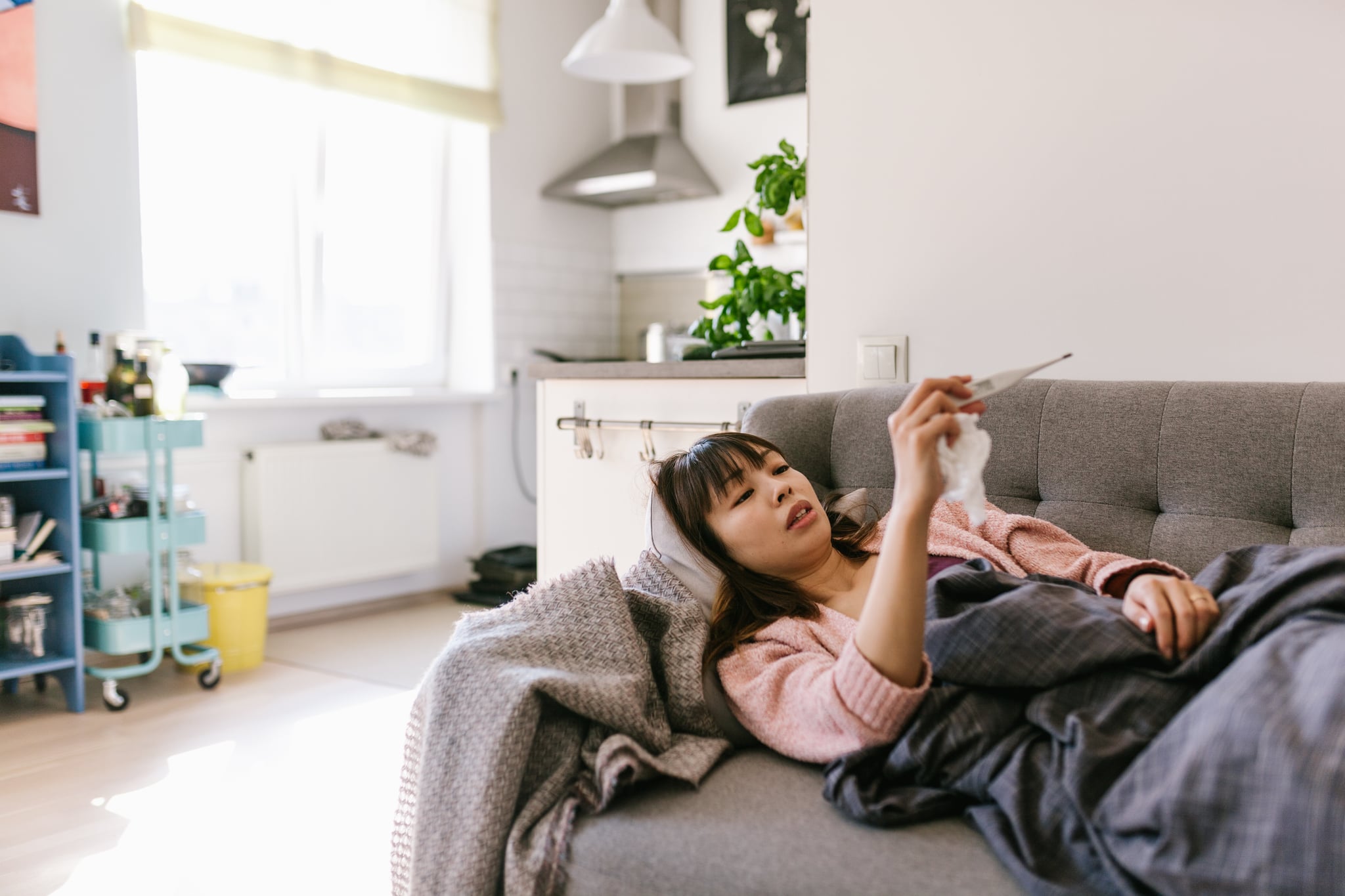 Sick at home series with a japanese man and woman.