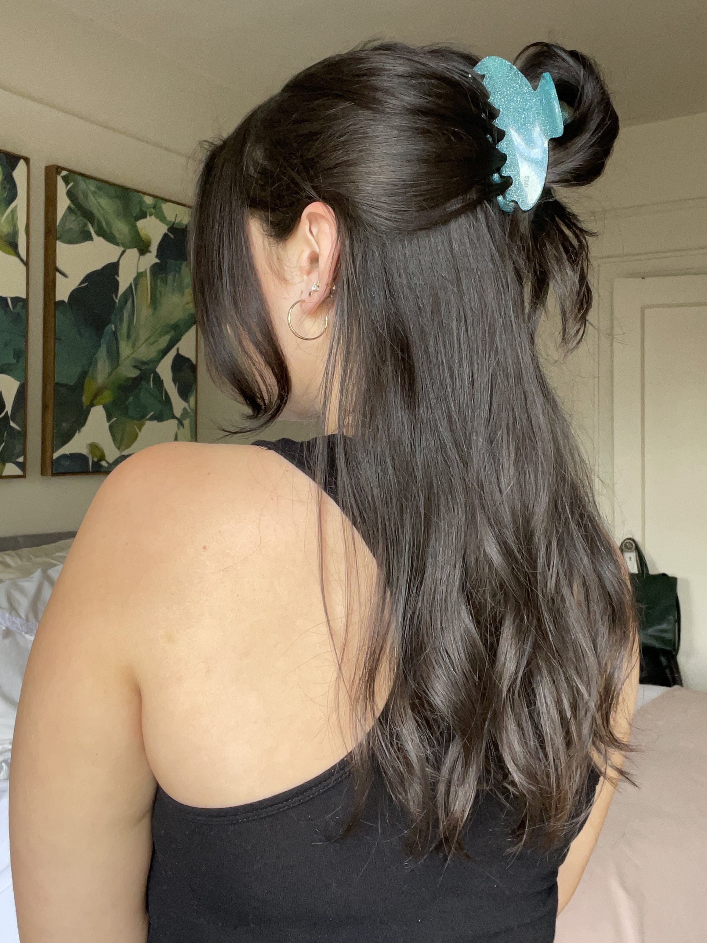 Image of half-up half-down hairstyle with a claw clip