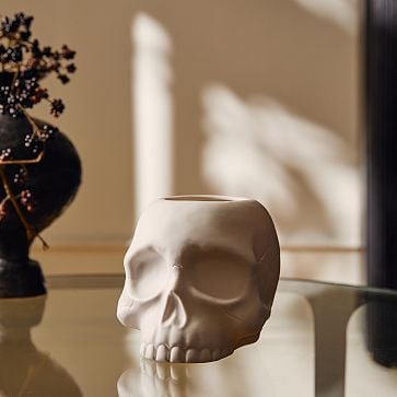 West Elm Skull Luminaries Candleholders ($25, originally $35)
Going for something gothic? This skull candleholder is a stunning piece that will give your space some elegance with an eerie vibe. Place this on your dining table as a centerpiece or on your bookcase or mantel. Depending on the size, it can fit a small votive to a large hurricane candle.