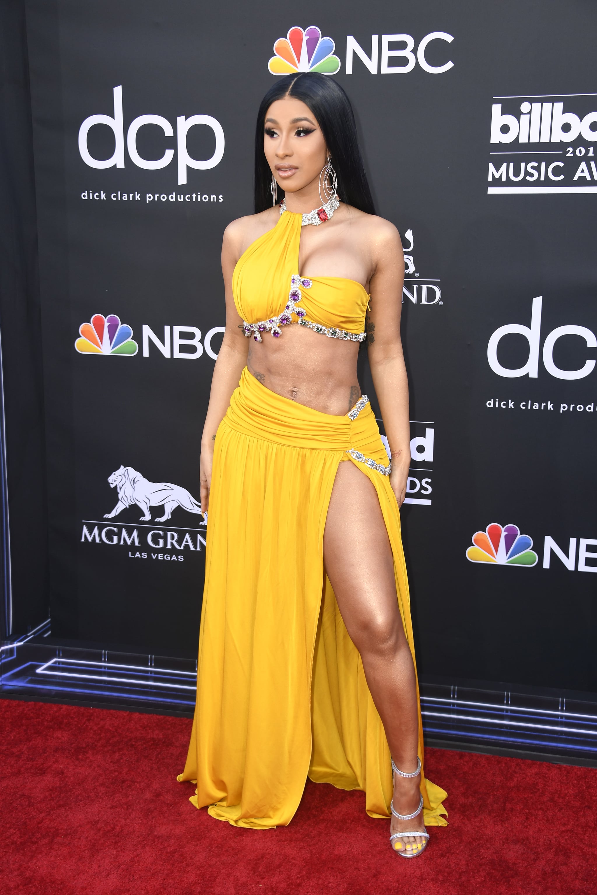 Cardi B's Louis Vuitton ponytail matches her crop top and skirt