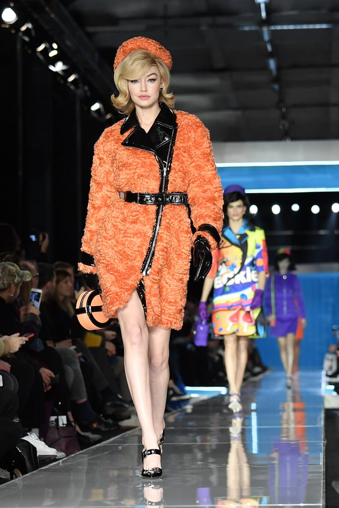 Gigi Wore an Orange Shearling and Leather Coat at Moschino