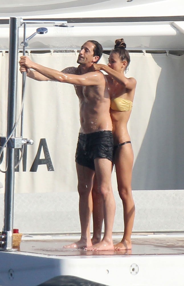 Adrien Brody and Lara Lieto got close while hanging on a yacht in St. Tropez during July 2012.