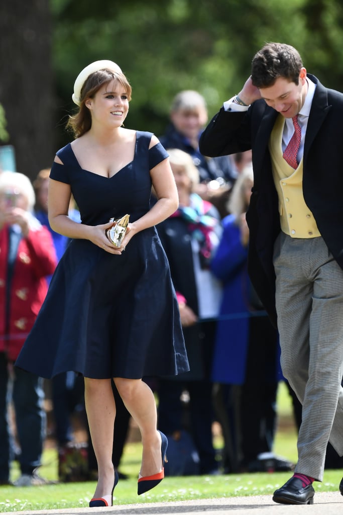 For Pippa Middleton and James Matthews's nuptials in May 2017, Eugenie chose a navy blue fit-and-flare by Paule Ka that she coordinated with colourblock Zara heels and a pillbox hat.