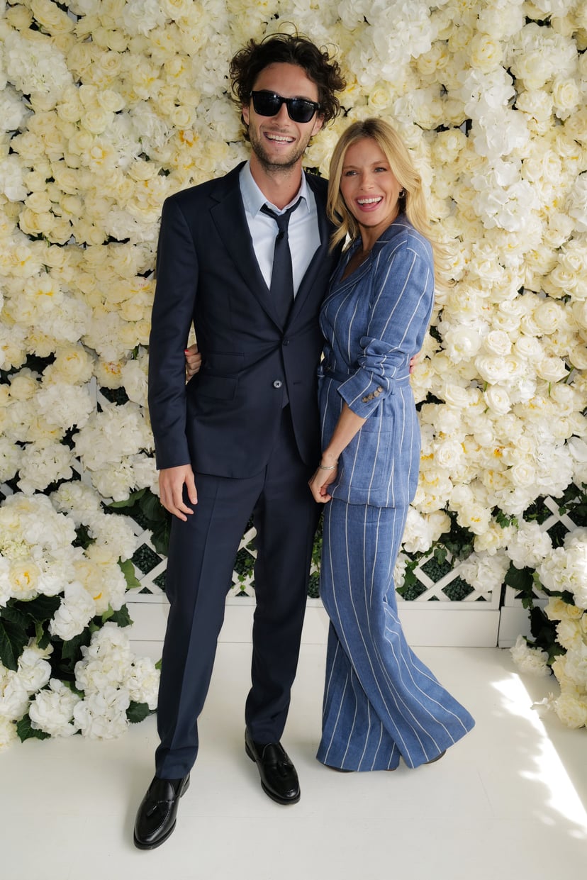 WIMBLEDON, ENGLAND - JULY 09: Sienna Miller and Oli Green, wearing Ralph Lauren, attends the Polo Ralph Lauren & British Vogue event during The Championships, Wimbledon at All England Lawn Tennis and Croquet Club on July 09, 2023 in Wimbledon, England. (P