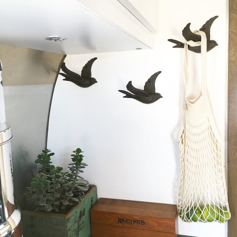 The Bird-Shaped Hooks on the Walls Are Both Functional and Cute