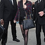 Outside the Chanel show during Paris Fashion Week, Miranda Kerr showed off a black quilted Chanel bag and a sophisticated checkered jacket.