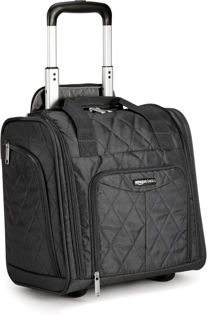 Amazon Basics Underseat Carry-On ($49)
The Amazon Basics Underseat Carry-On is perfect for the traveler on the go. For starters, unlike most weekender bags and duffels, this one has wheels. You can carry this with its top handle or roll it through the airport. It's spacious on the inside with plenty of pockets and sections to stay organized, including a spot for your shoes. You could even attach a Popsugar Travel Neck Pillow ($20) to the handle, if you felt inclined.
Pros: Perfect for underseat storage and spacious.
Cons: It's smaller than it looks.
Material: Ballistic nylon.
Dimensions: 13.4" height x 14.2" wide x 9.5" depth
Colorways: 4
Who it's best for: Great for the everyday traveler.
What Reviewers Say: "Great bag for a quick trip. It fit 3 days of outfits , including a sweatshirt and pair of shoes, plus a few extras just in case, the carry-on liquids bag, a small cosmetic bag, charger, a few books, and some small accessories and zipped shut with no problem. It rolled fine throughout the airport and it was pretty easy to manipulate the handle, although it did get stuck a time or two when it wiggled and one of the little tabs came through the hole when it wasn't supposed to."