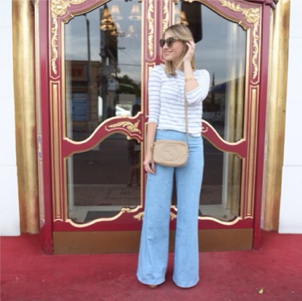 Flared denim and a striped tee are as easy as they are chic. 
Source: Instagram user emilyschuman