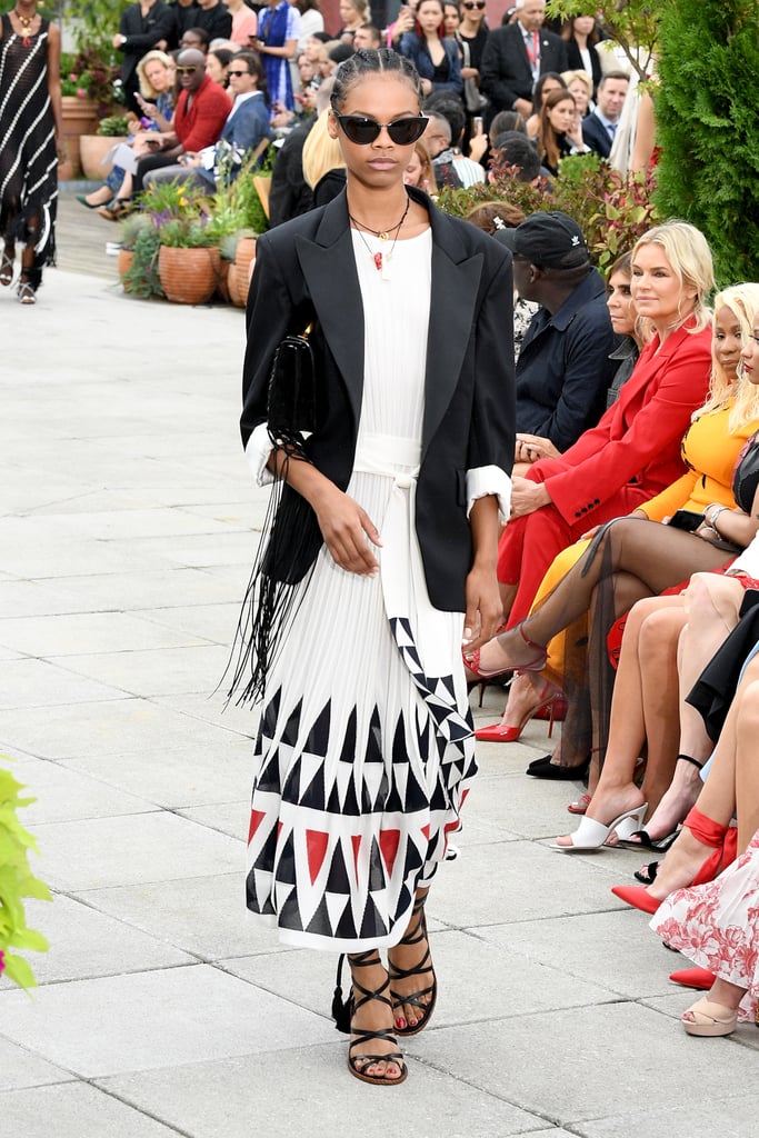 If Kate decided to opt for a more relaxed skirt suit style (as point the trends these days!), we think she'd look lovely in this oversize blazer and graphic print pleated ensemble that went down the runway.
