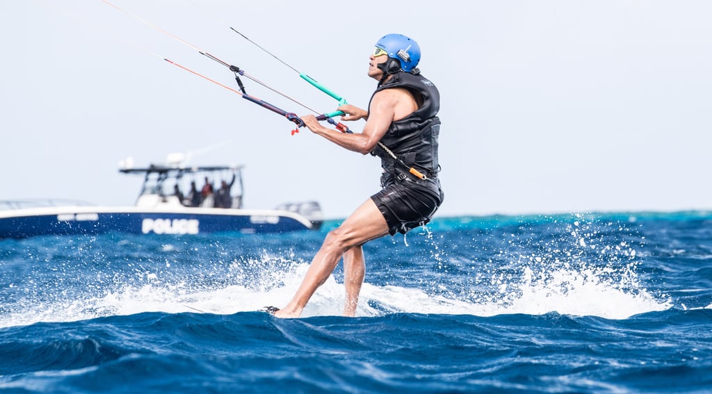 Days later, Barack really let loose when he accepted Richard Branson's kitesurfing challenge. Clad in a tank top and swim trunks, Barack seemed to be in full relaxation mode as he rode the waves and splashed around in the water.