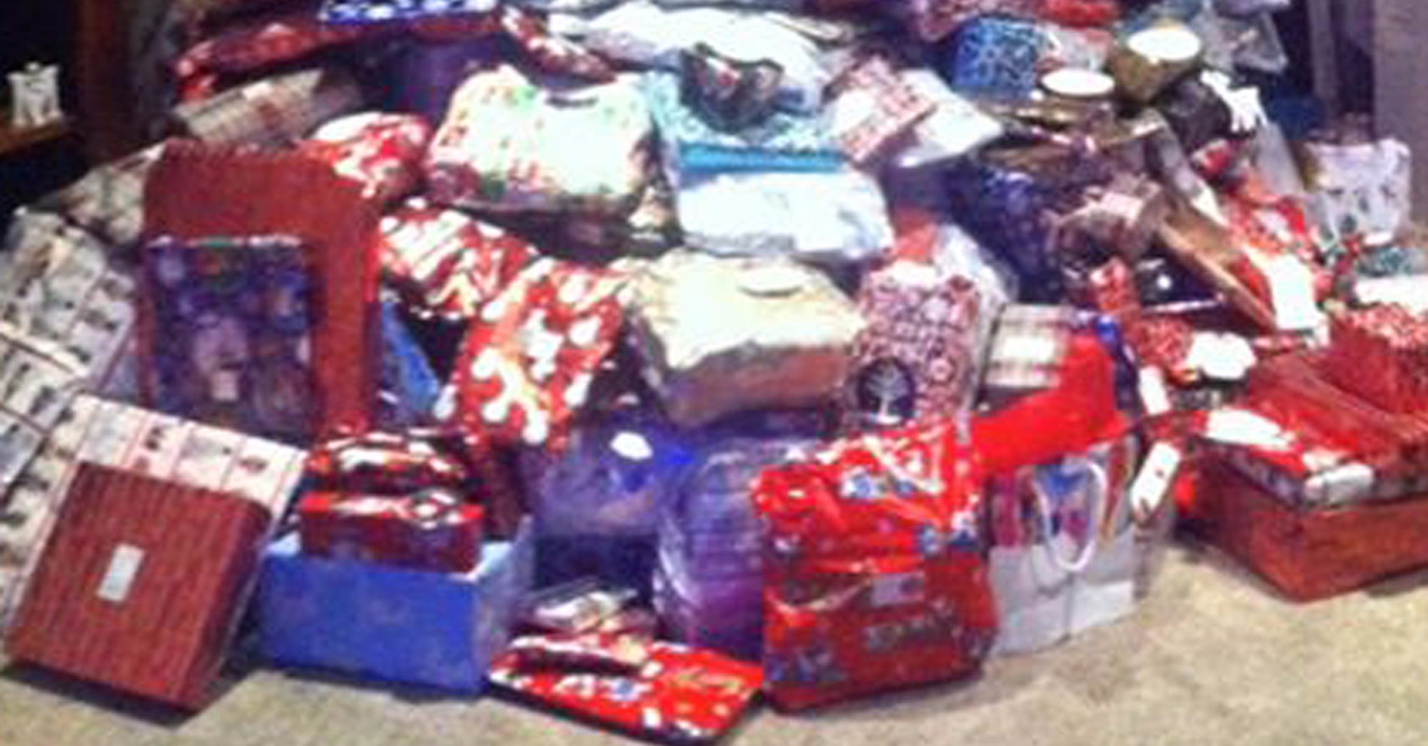 Christmas Presents Stacked as Tall as the Christmas Tree | PS Family