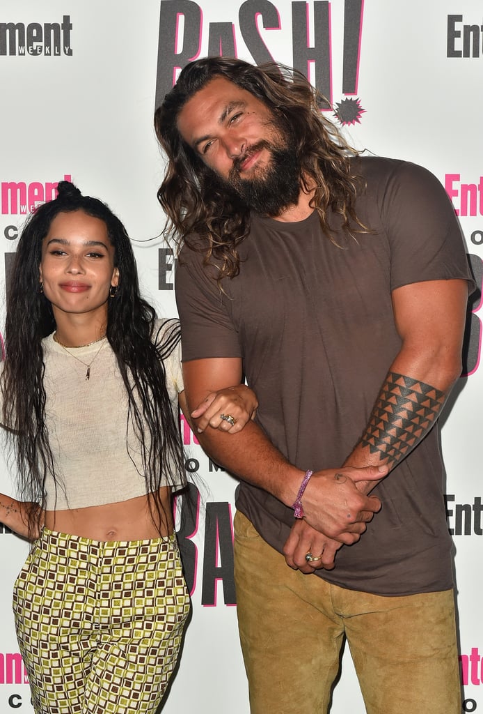 Comic-Con ended up being a family reunion for Jason Momoa and Zoë Kravitz on July 21. After Jason introduced his two kids, Nakoa-Wolf and Lola, to Chris Pratt, he and Zoë had the chance to party and pose for pictures together. The two were at the San Diego convention for completely different projects; Jason helped to unveil the trailer for Aquaman, and Zoë participated in a Fantastic Beasts panel, but they still made time for a quick red carpet meetup. 
While Zoë is the daughter of Lisa Bonet and Lenny Kravitz, Jason has been with her mother since 2005, and it's clear he and Zoë share a special bond — they even have matching tattoos! Ahead, see more sweet snaps of their time together below, and make sure to check out his cutest couples moments with Lisa Bonet. 

    Related:

            
            
                                    
                            

            Jason Momoa&apos;s Adorable Family Snaps Make It Obvious That He&apos;s One Proud Papa